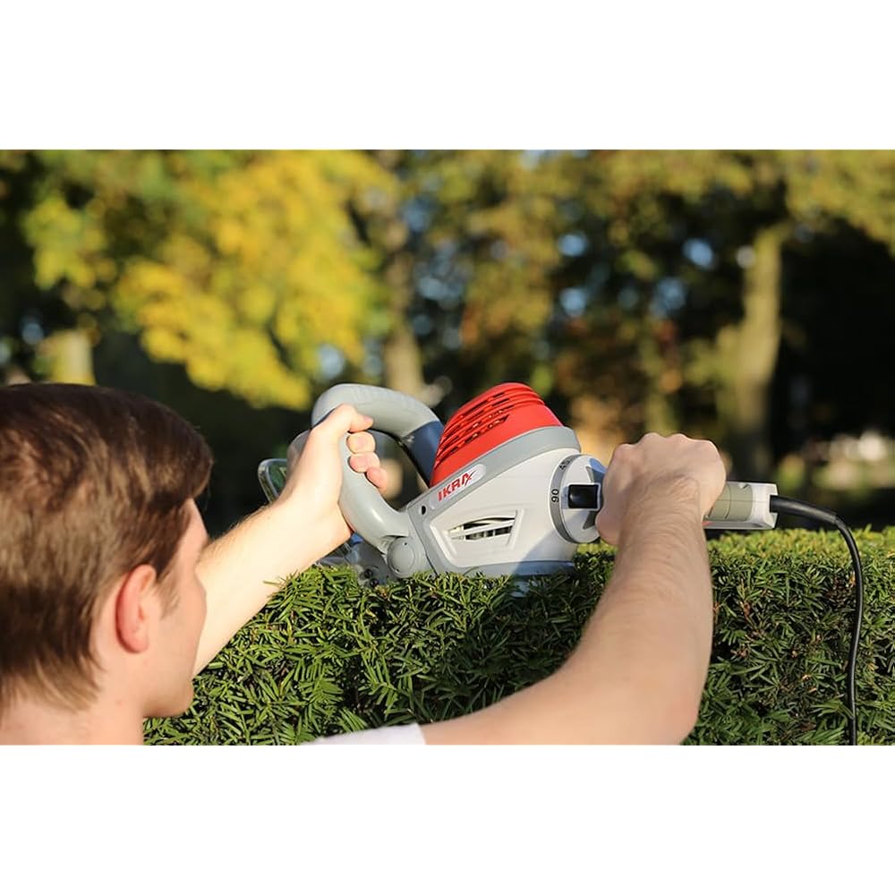 IKRA taille-haie électrique IHS 650 longueur de coupe 55cm, ecartement 22mm, 650W, poignée tournante à 180° : Jardin